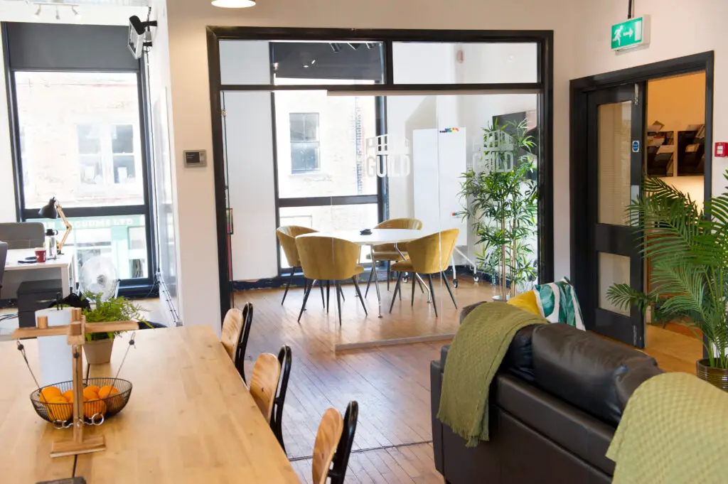 Our four person meeting room viewed from our upstairs coworking area.