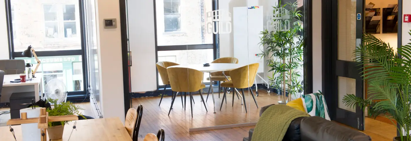 Our four person meeting room viewed from our upstairs coworking area.